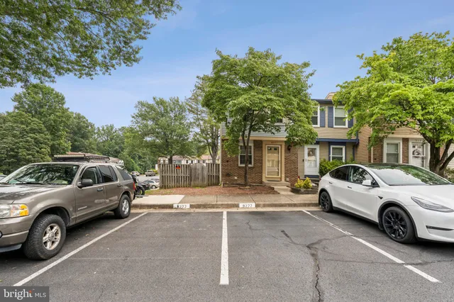 a view of a car parked in front of a house