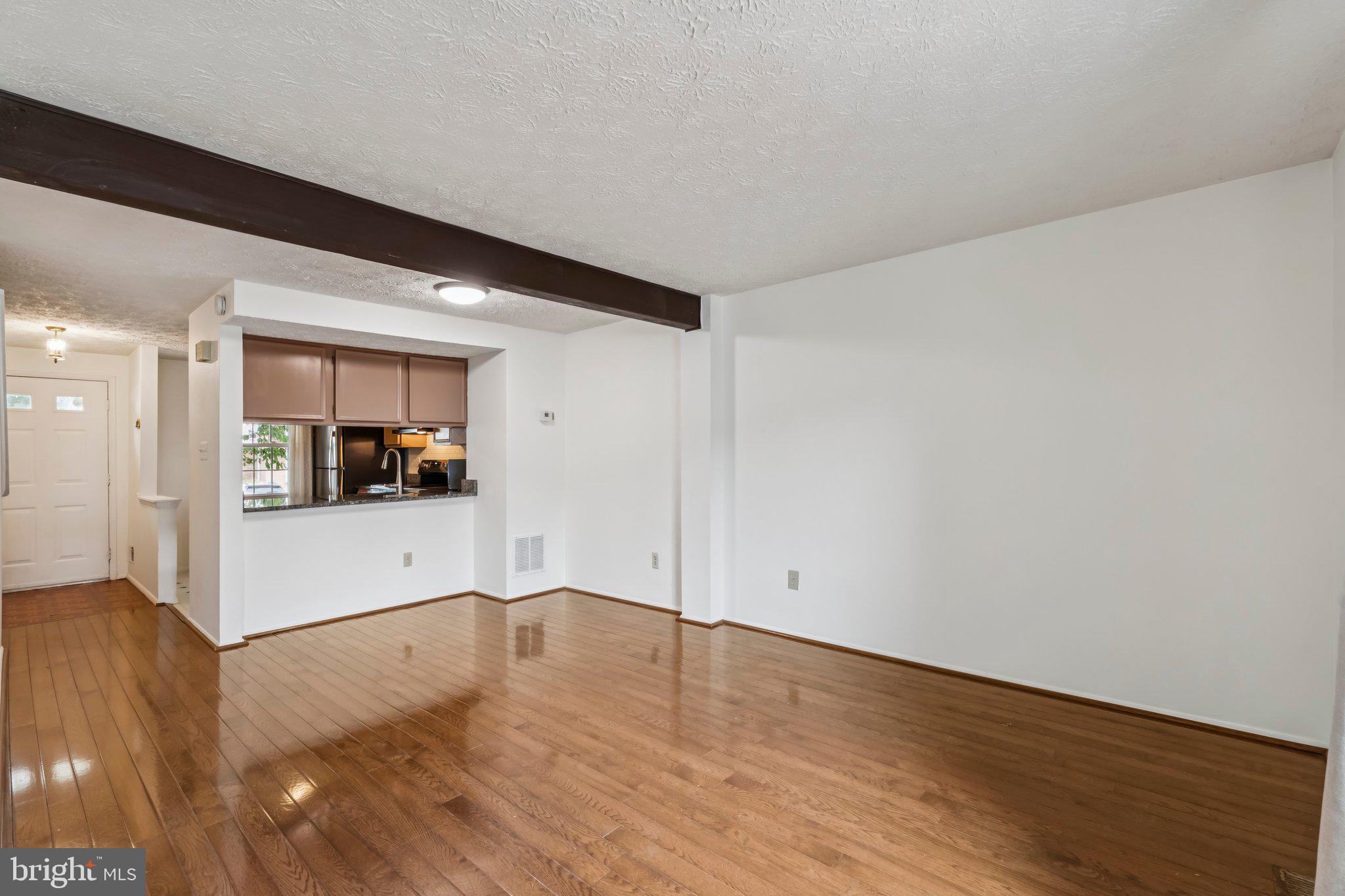 8277 Crestmont Circle Springfield, VA 22153 - Photo 5 of 23 a view of a room with wooden floor and a sink