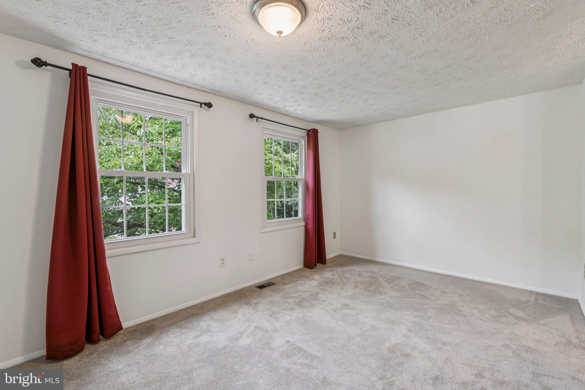 8277 Crestmont Circle Springfield, VA 22153 - Photo 7 of 23 a view of an empty room with a window
