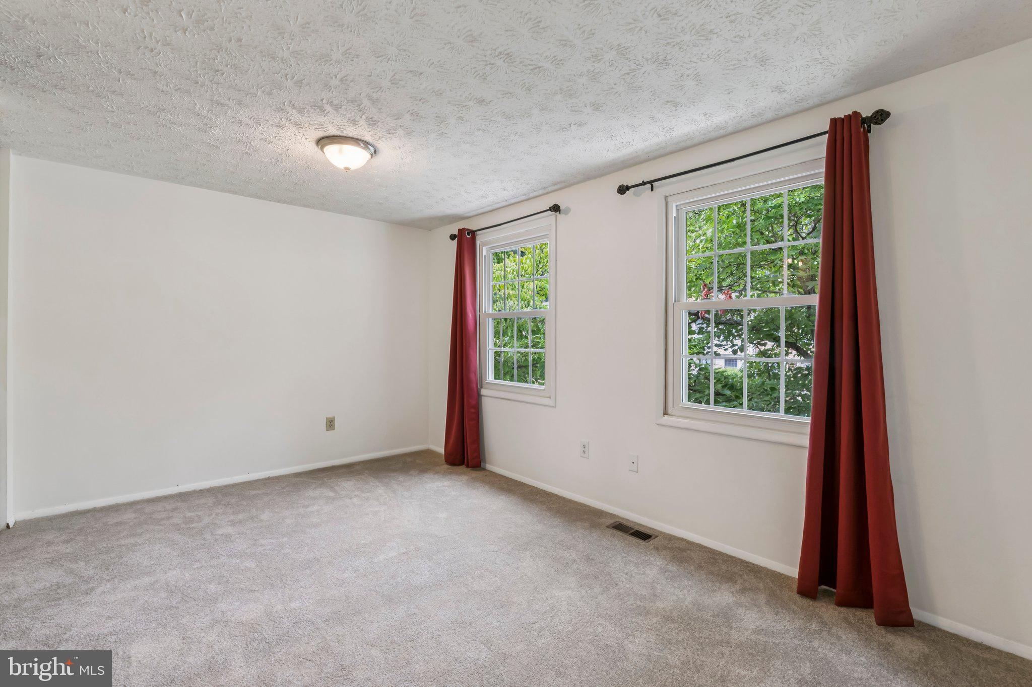 8277 Crestmont Circle Springfield, VA 22153 - Photo 8 of 23 an empty room with windows