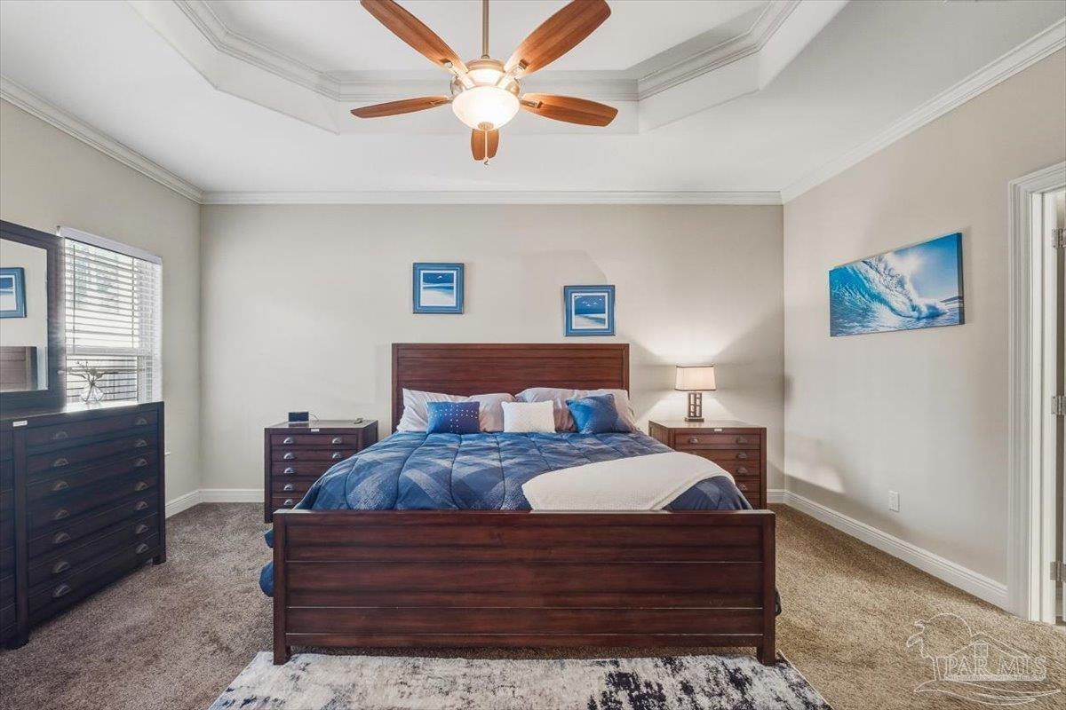 8756 Olivera Street Navarre, FL 32566 - Photo 19 of 41 a bed room with a bed and a chandelier