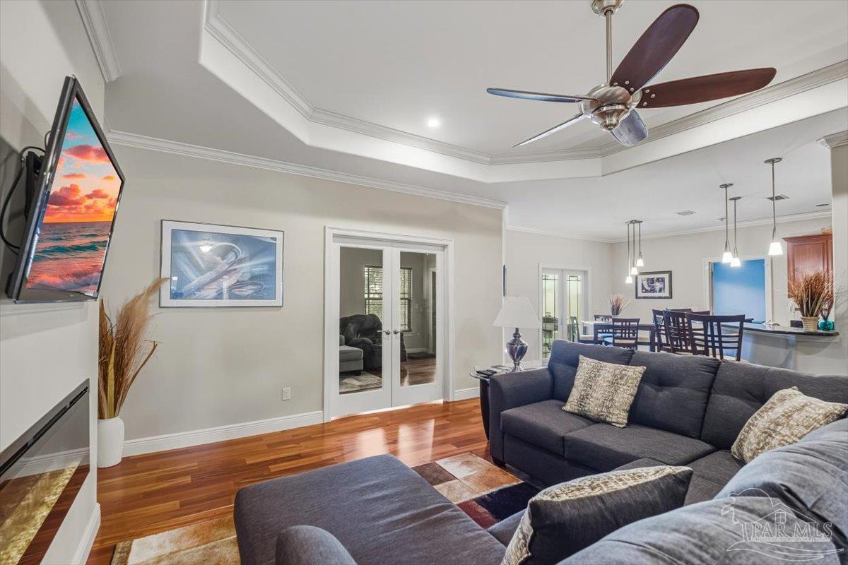 8756 Olivera Street Navarre, FL 32566 - Photo 2 of 41 a living room with furniture and a large window