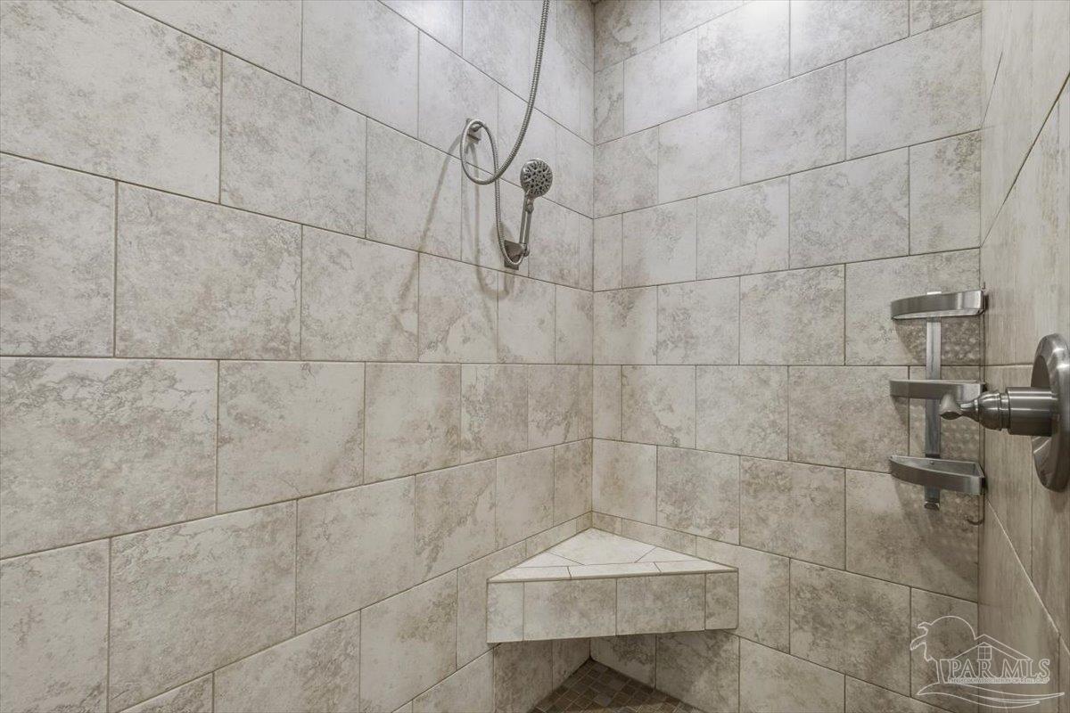 8756 Olivera Street Navarre, FL 32566 - Photo 25 of 41 a bathroom with a shower