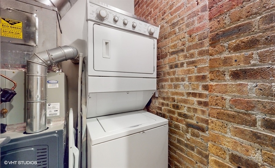 1040 West Adams Street, Unit 347 Chicago, IL 60607 - Photo 21 of 29 a utility room with dryer and washer