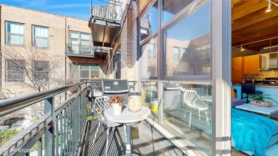 1040 West Adams Street, Unit 347 Chicago, IL 60607 - Photo 22 of 29 a balcony view with couple of chairs