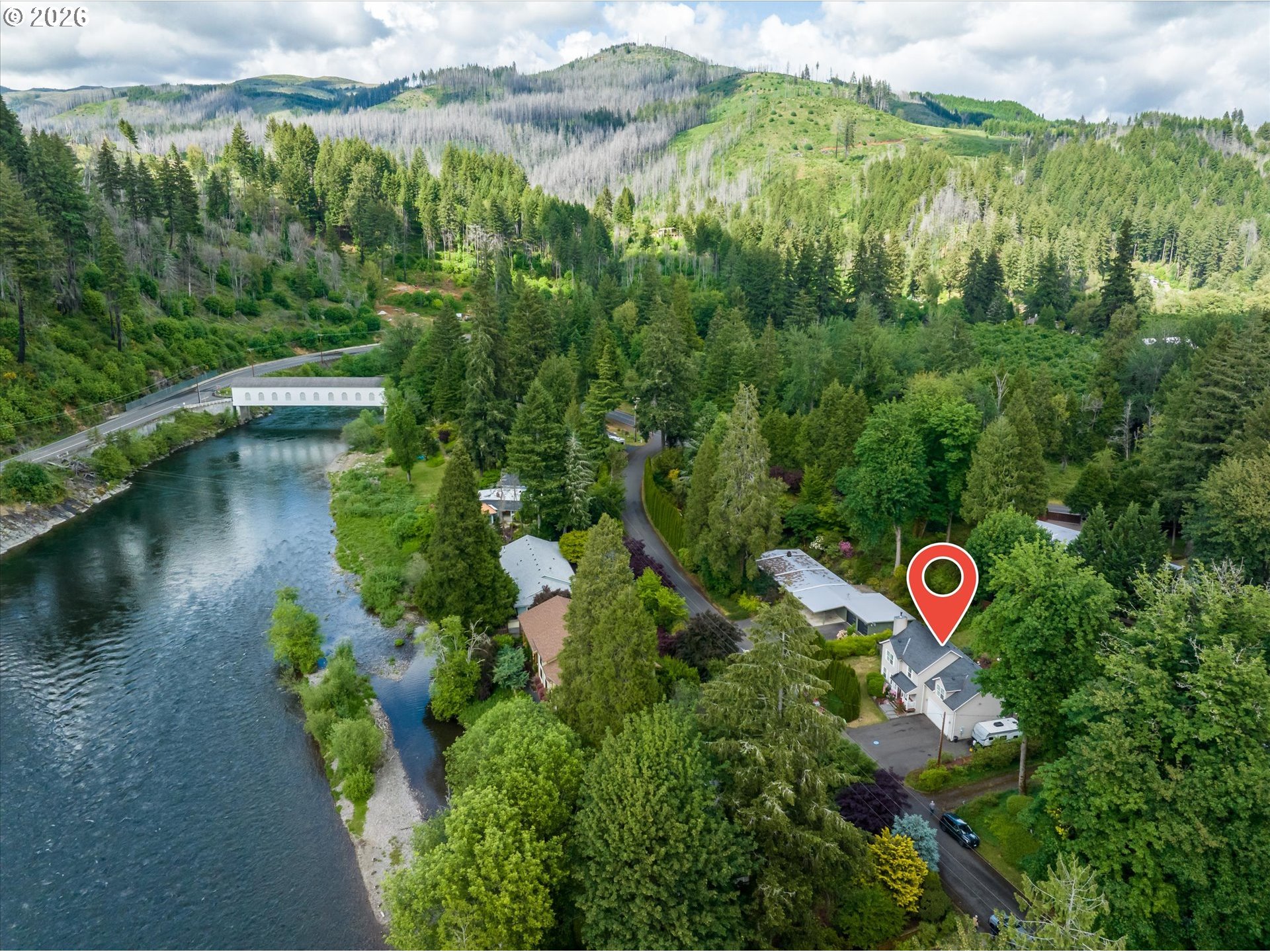 91051 Leashore Drive Vida, OR 97488 - Photo 36 of 36 a view of a lake with a building in the background
