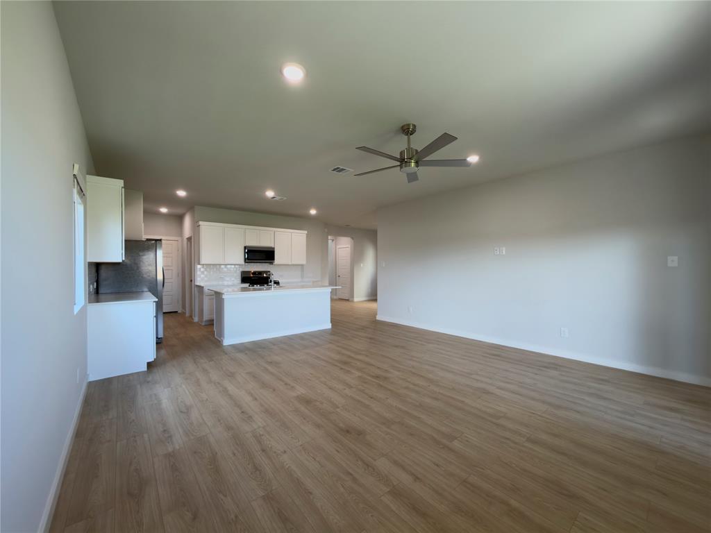 120 Millwood Road Lavon, TX 75166 - Photo 6 of 34 Open-concept living space featuring wood-finish flooring, recessed lighting, and a ceiling fan