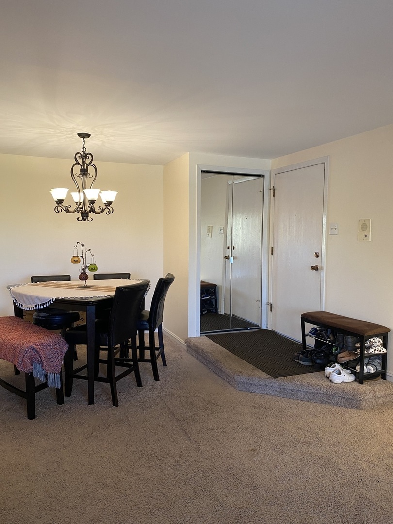 5221 James Lane, Unit 1511 Crestwood, IL 60418 - Photo 9 of 13 a view of a livingroom with furniture and a chandelier