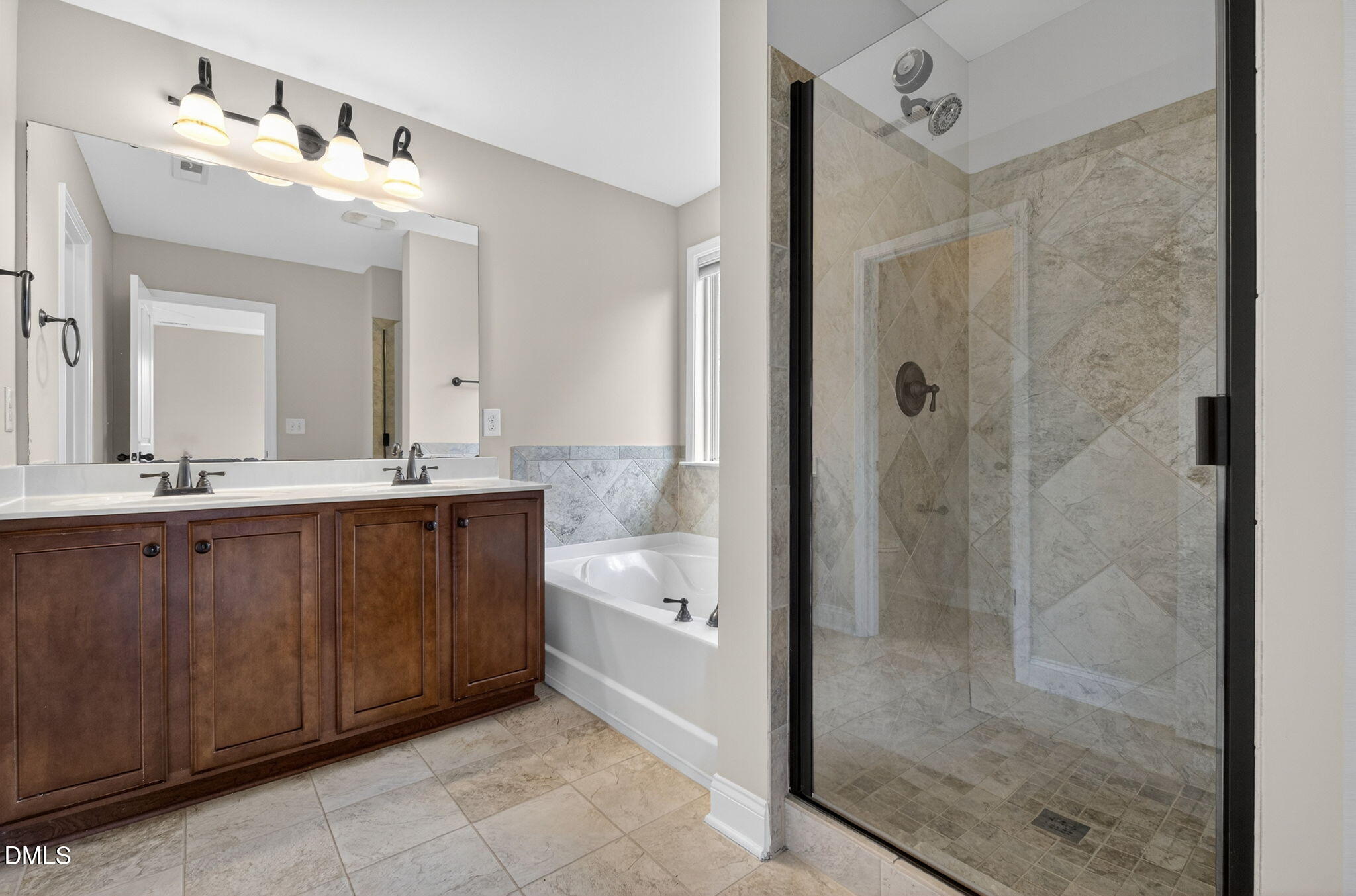 1304 Barnford Mill Road Wake Forest, NC 27587 - Photo 28 of 44 a bathroom with a double vanity sink mirror and shower