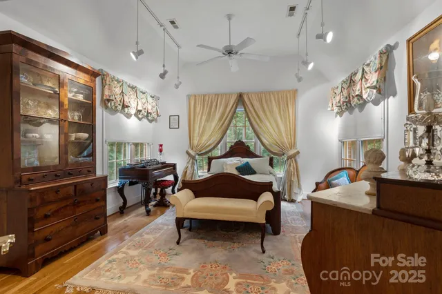 a living room with furniture a table and a chandelier