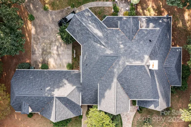 an aerial view of house with a yard