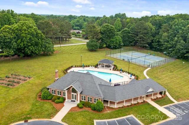 an aerial view of a house with a swimming pool