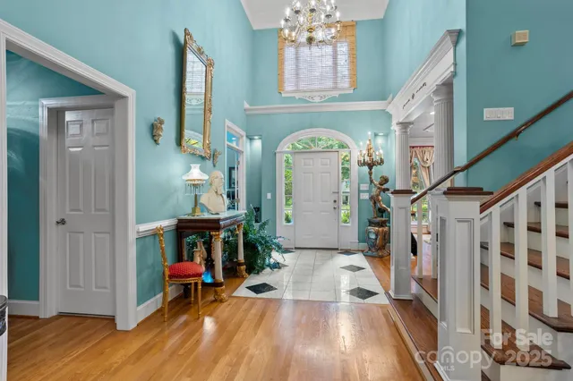 a view of living room with furniture and wooden floor
