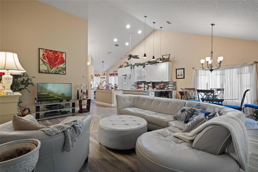 1801 East Lake Road South, Unit 5A Palm Harbor, FL 34685 - Photo 13 of 22 a living room with furniture and a flat screen tv