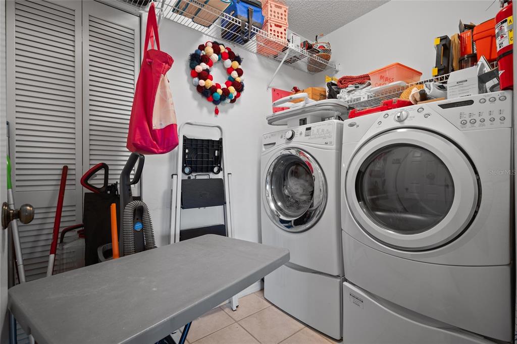 1801 East Lake Road South, Unit 5A Palm Harbor, FL 34685 - Photo 22 of 22 a utility room with dryer and washer