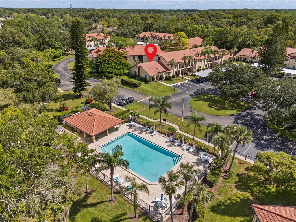 1801 East Lake Road South, Unit 5A Palm Harbor, FL 34685 - Photo 3 of 22 an aerial view of residential houses with outdoor space