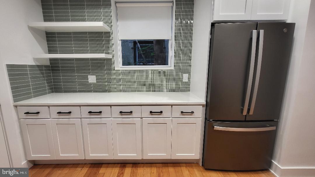 1237 South 27th Street Philadelphia, PA 19146 - Photo 11 of 36 a kitchen with stainless steel appliances granite countertop a refrigerator and a sink