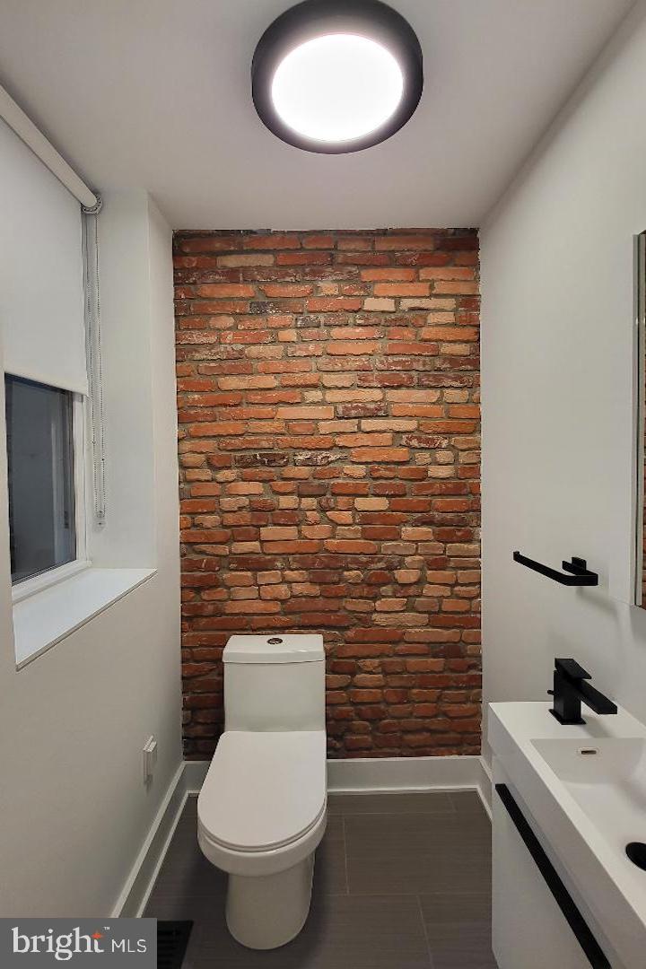 1237 South 27th Street Philadelphia, PA 19146 - Photo 13 of 36 a bathroom with a toilet and a sink