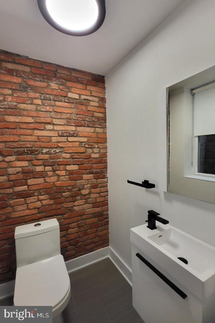 1237 South 27th Street Philadelphia, PA 19146 - Photo 14 of 36 a bathroom with a toilet and a sink