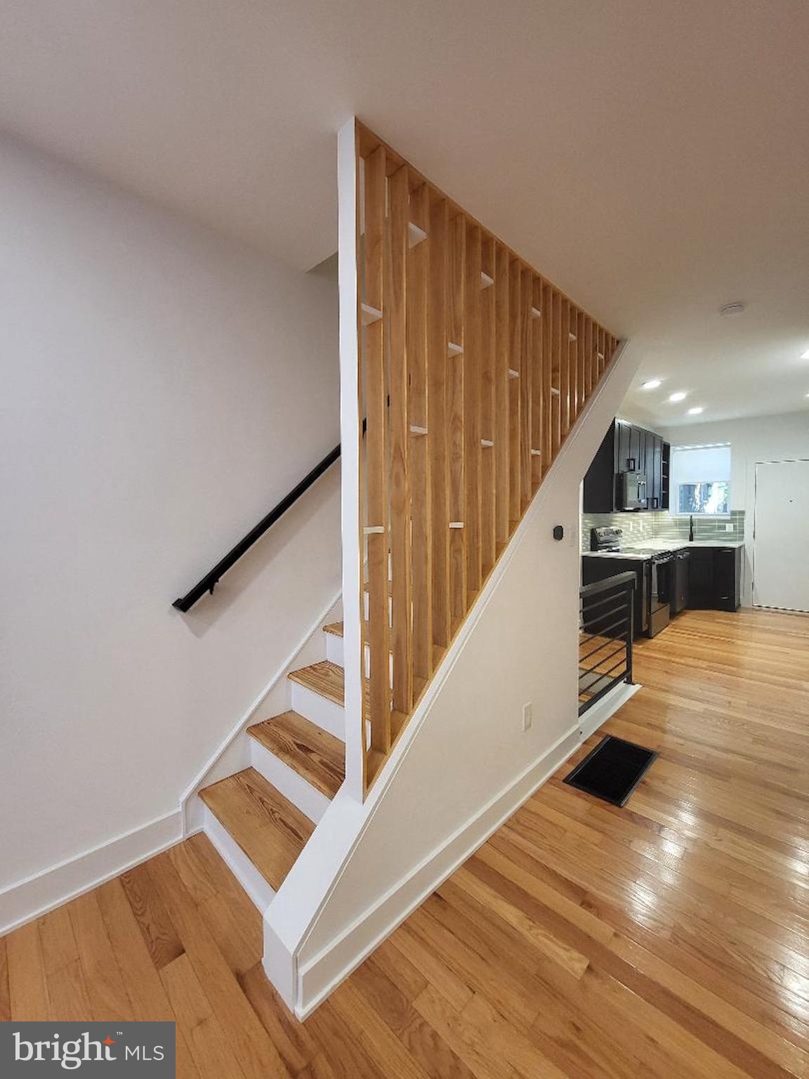 1237 South 27th Street Philadelphia, PA 19146 - Photo 16 of 36 a view of entryway and hall with wooden floor