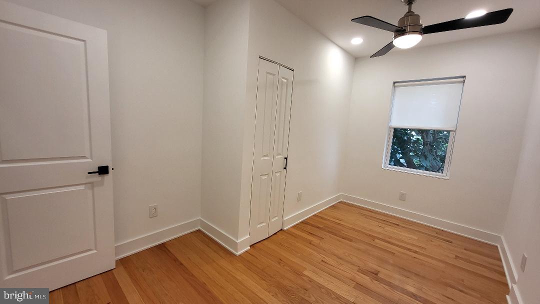1237 South 27th Street Philadelphia, PA 19146 - Photo 18 of 36 wooden floor in an empty room with a window