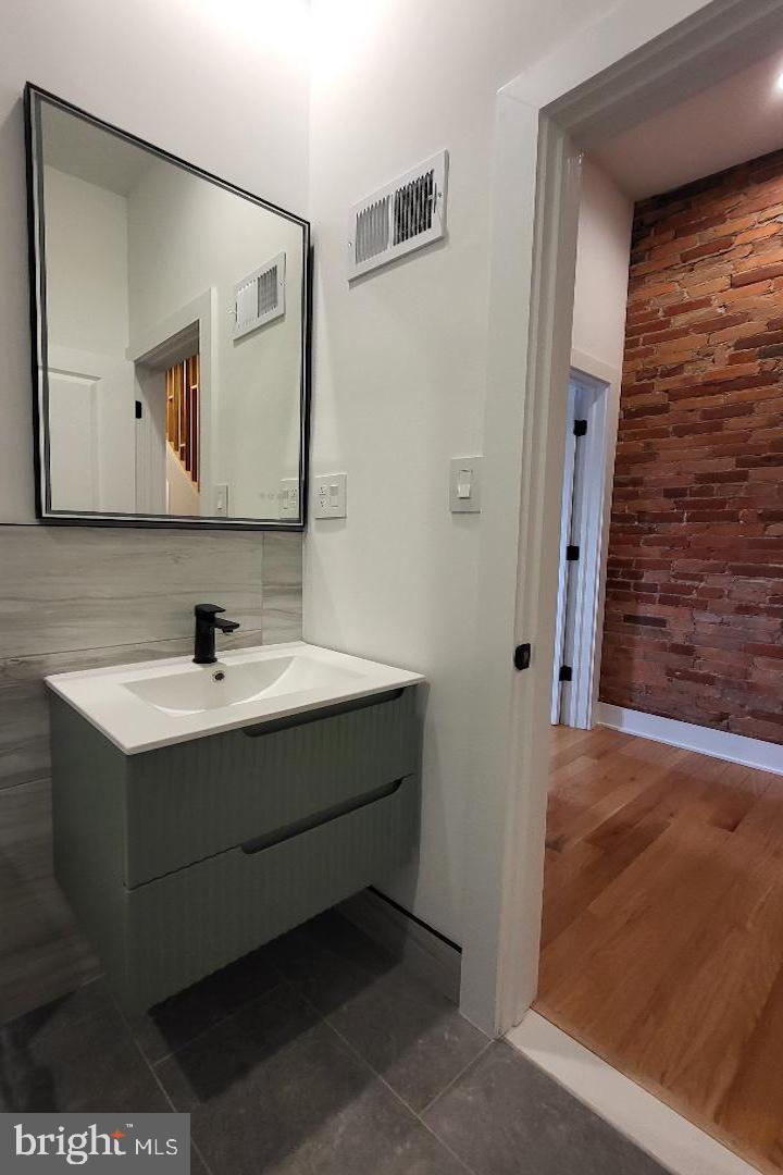 1237 South 27th Street Philadelphia, PA 19146 - Photo 22 of 36 a bathroom with a sink and a mirror