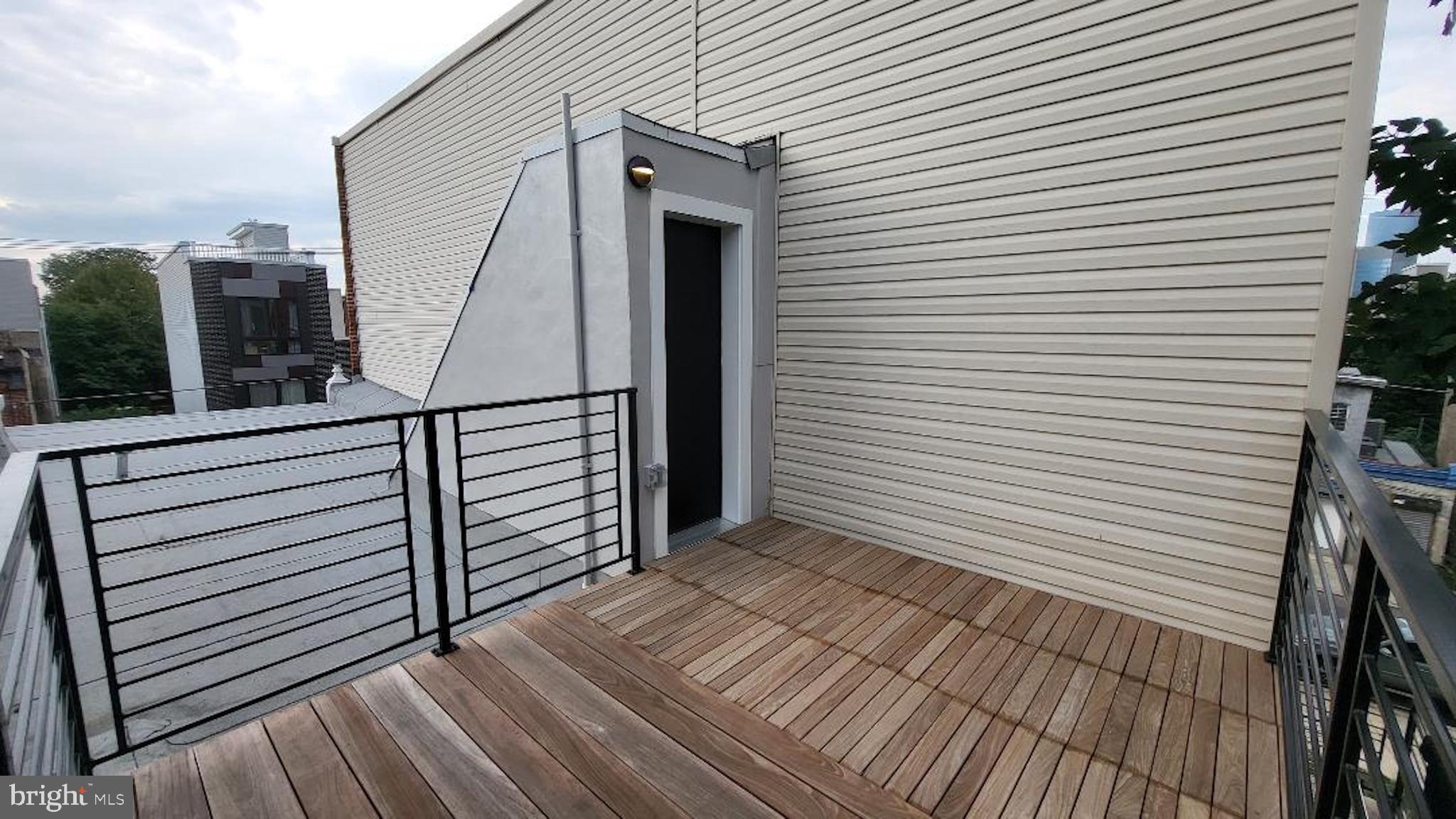 1237 South 27th Street Philadelphia, PA 19146 - Photo 28 of 36 a view of a balcony with wooden floor and fence