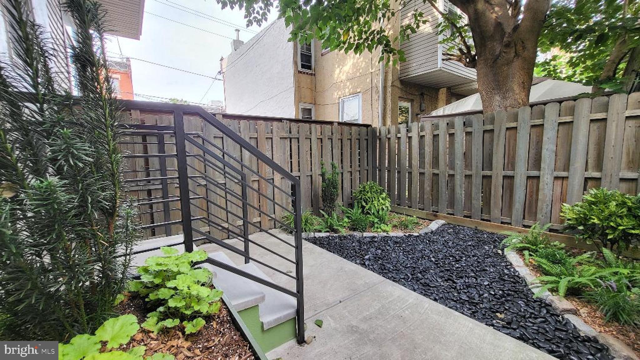 1237 South 27th Street Philadelphia, PA 19146 - Photo 36 of 36 a view of a house with a flower garden
