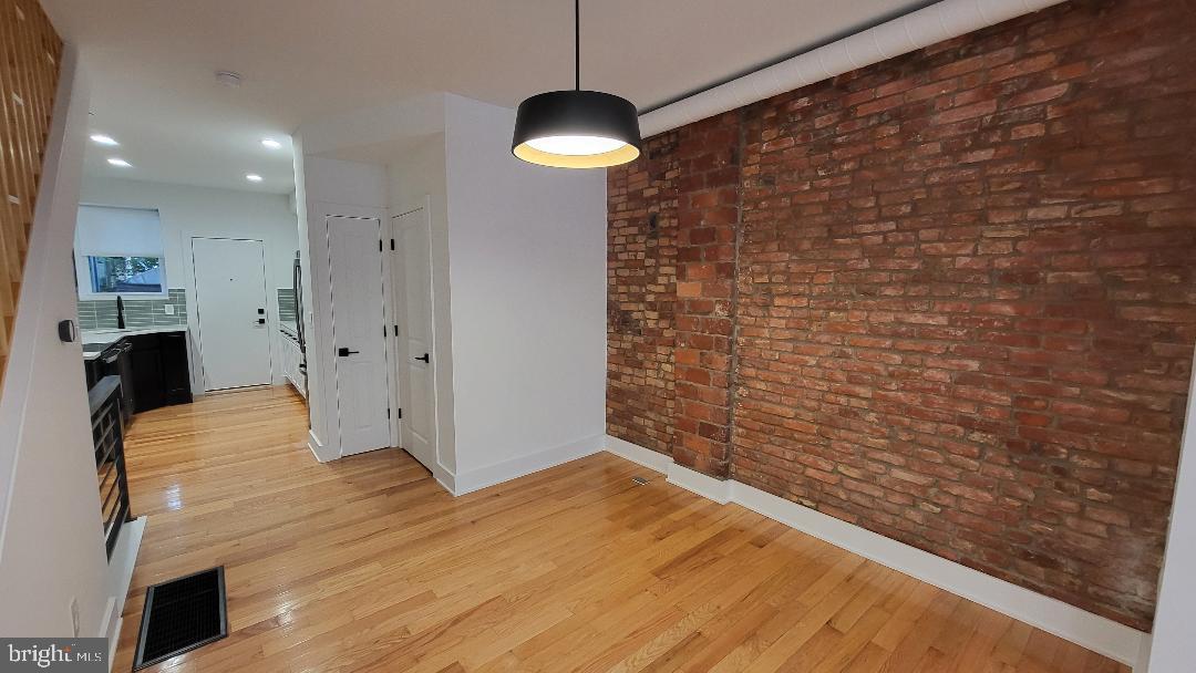 1237 South 27th Street Philadelphia, PA 19146 - Photo 5 of 36 a view of a livingroom with wooden floor and a ceiling fan