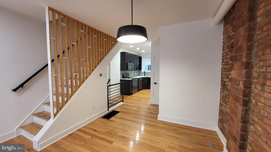 1237 South 27th Street Philadelphia, PA 19146 - Photo 7 of 36 a view of entryway and hall with wooden floor
