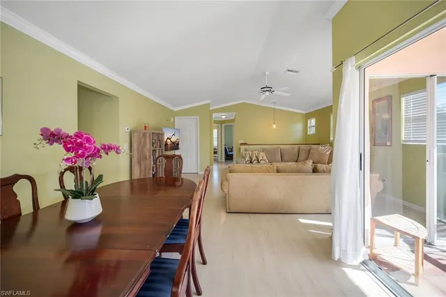 a view of a living room and dining room