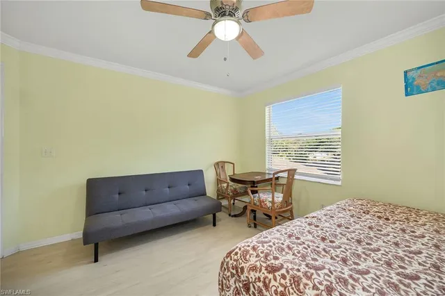 a bedroom with a bed and a desk