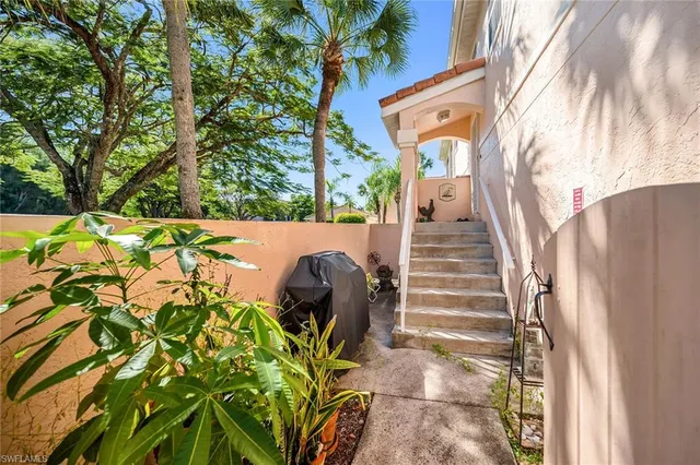 a view of a backyard with chairs