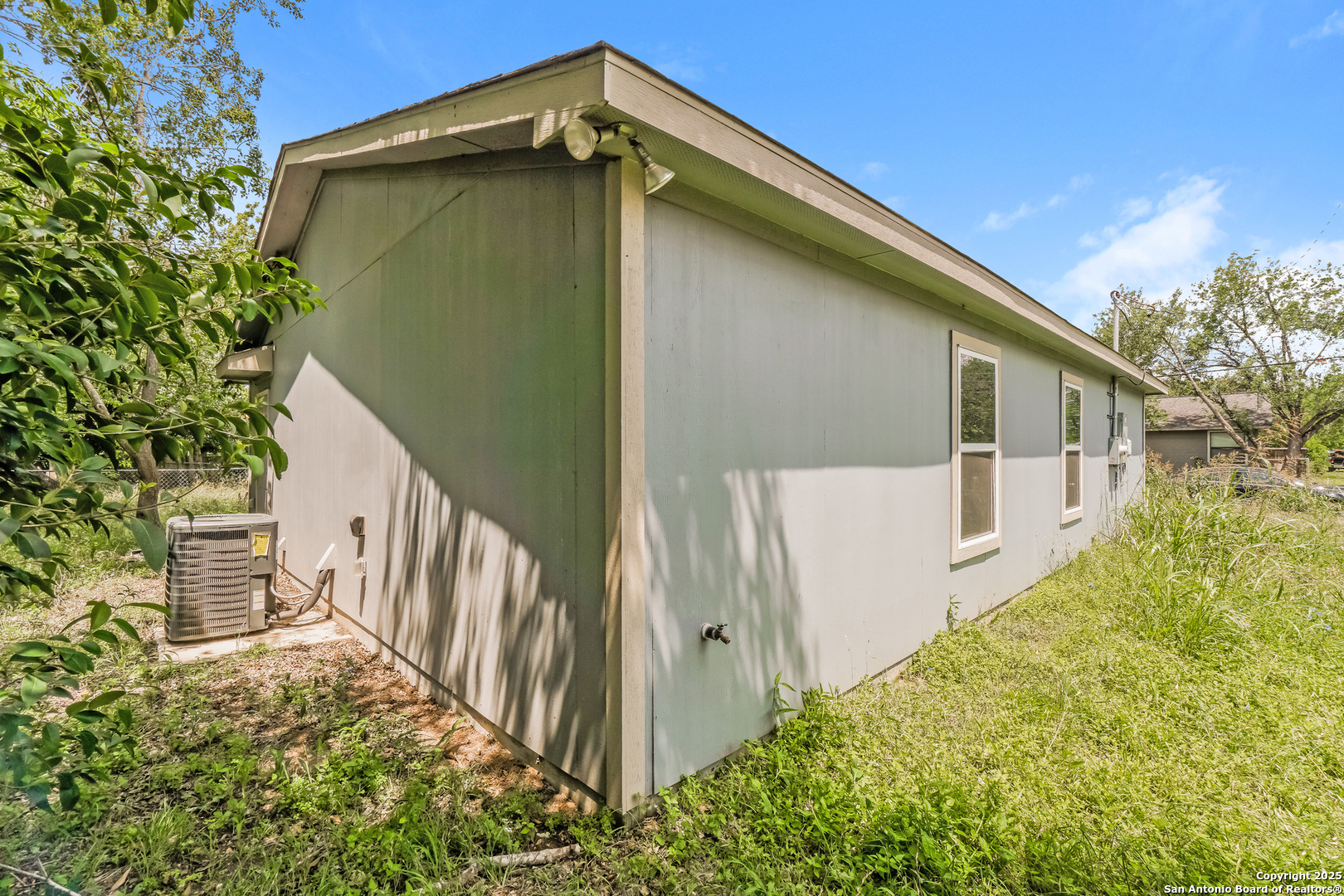 527 Elley Street Seguin, TX 78155 - Photo 20 of 21 a backyard of a house with wooden fence and large trees