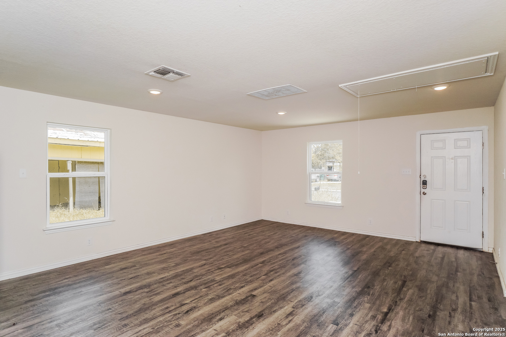 527 Elley Street Seguin, TX 78155 - Photo 6 of 21 a view of empty room with wooden floor and fan