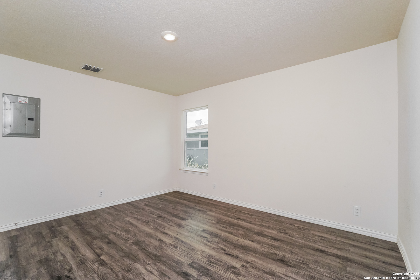 527 Elley Street Seguin, TX 78155 - Photo 10 of 21 a view of empty room with wooden floor