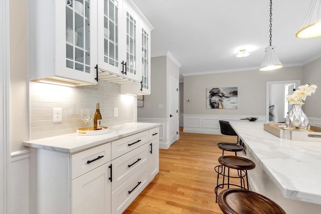 14 Yerxa Road Arlington, MA 02474 - Photo 15 of 42 a kitchen with white cabinets and sink