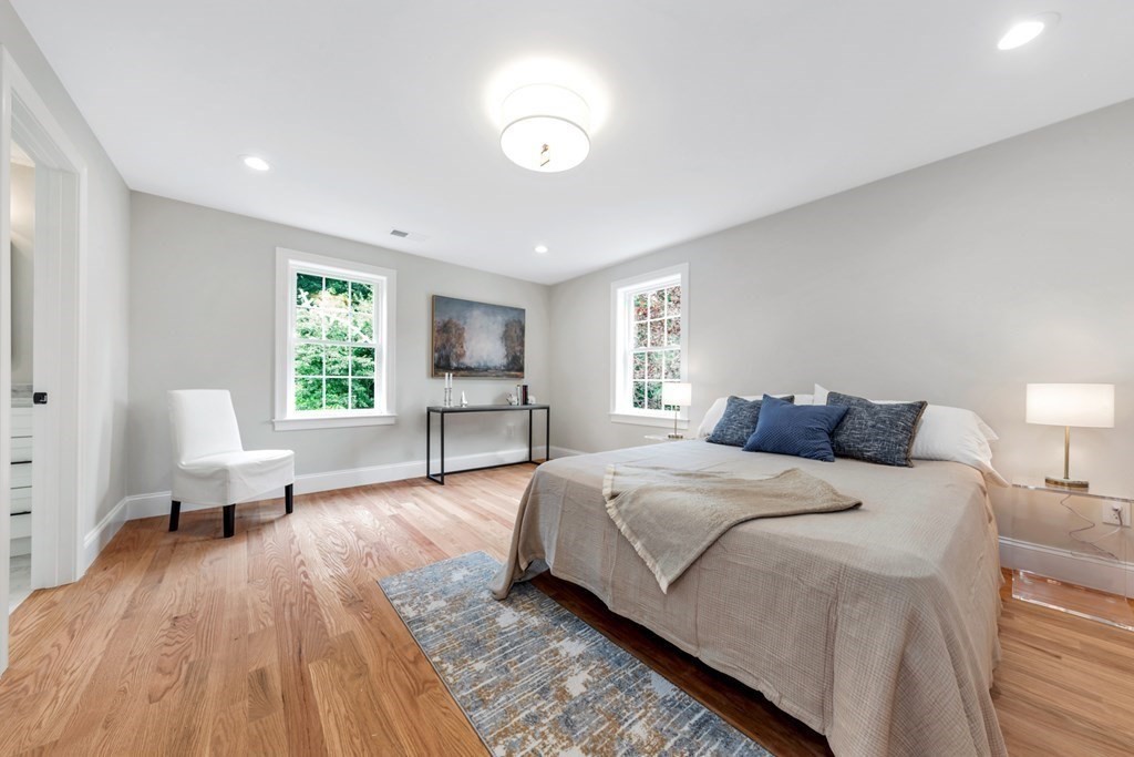14 Yerxa Road Arlington, MA 02474 - Photo 26 of 42 a spacious bedroom with a bed and a couch