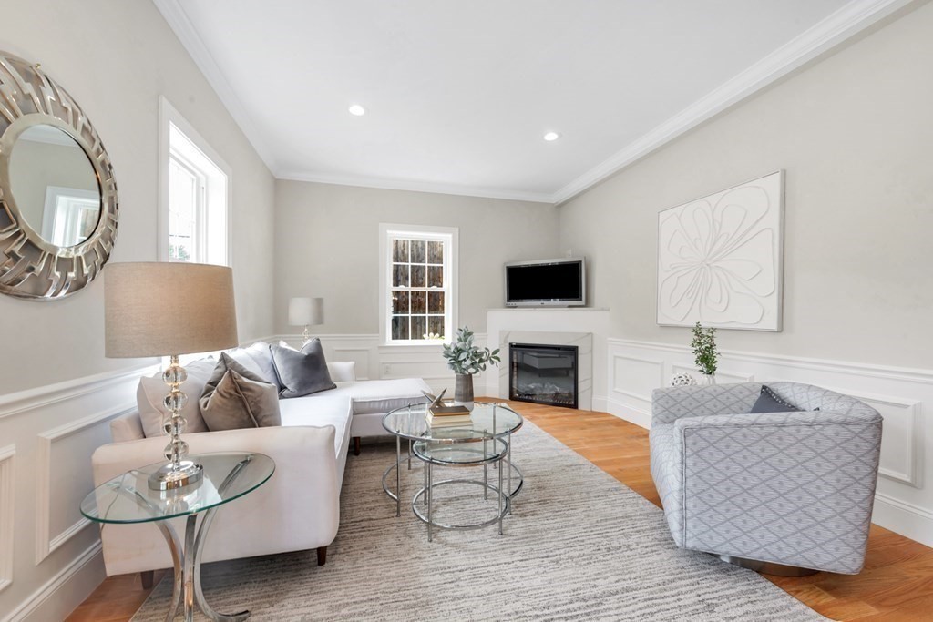 14 Yerxa Road Arlington, MA 02474 - Photo 4 of 42 a living room with furniture fireplace and a flat screen tv