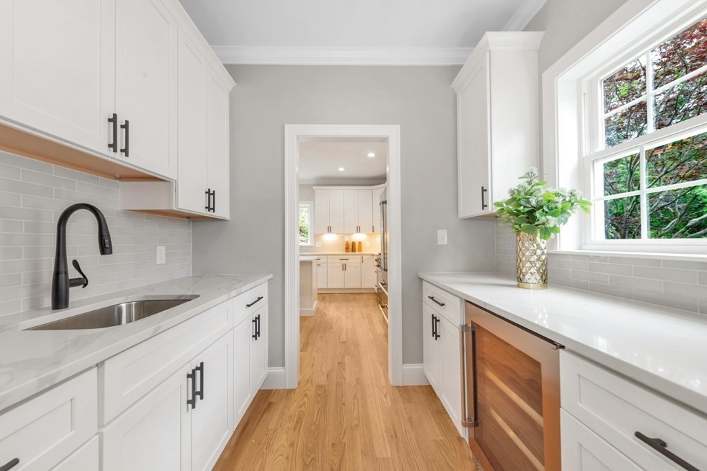 14 Yerxa Road Arlington, MA 02474 - Photo 8 of 42 a view of a kitchen sink and a dishwasher with wooden floor