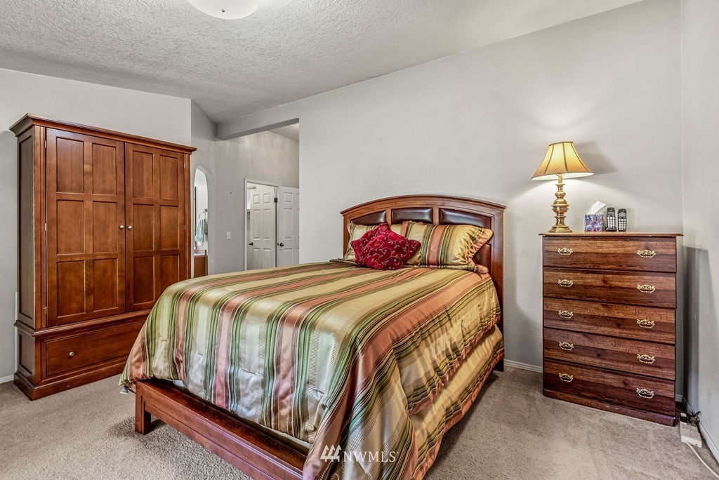 207 Apple Creek Road Longview, WA 98632 - Photo 11 of 33 a bedroom with a bed and a cabinets