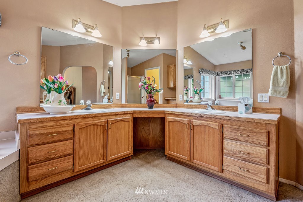 207 Apple Creek Road Longview, WA 98632 - Photo 14 of 33 a spacious bathroom with a granite countertop sink and a mirror