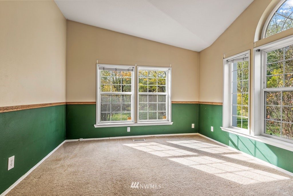 207 Apple Creek Road Longview, WA 98632 - Photo 19 of 33 a view of a room with a large window and refrigerator