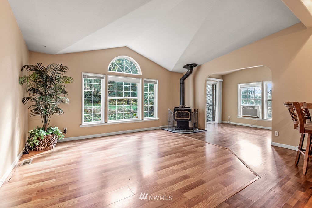 207 Apple Creek Road Longview, WA 98632 - Photo 3 of 33 a view of an empty room with window and wooden floor