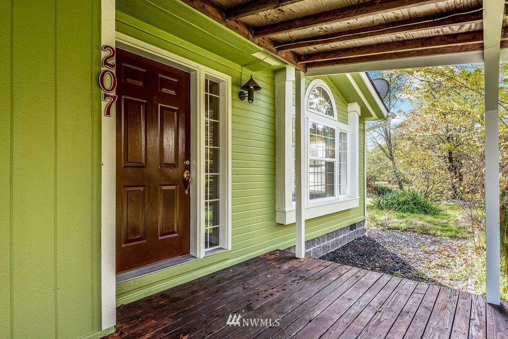 207 Apple Creek Road Longview, WA 98632 - Photo 21 of 33 a view of porch with a door and wooden floor