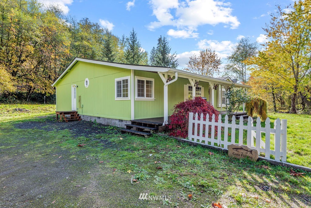 207 Apple Creek Road Longview, WA 98632 - Photo 26 of 33 a view of a house with a yard and a garden