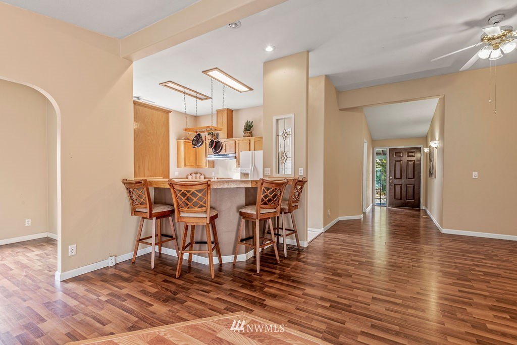207 Apple Creek Road Longview, WA 98632 - Photo 8 of 33 a view of a dining room with furniture and wooden floor