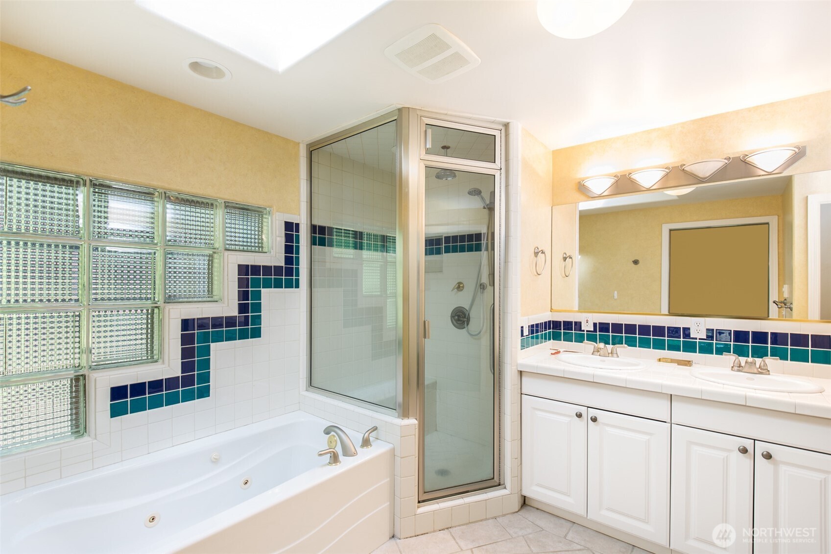 123 Forest Ridge Drive Sequim, WA 98382 - Photo 26 of 32 a bathroom with a bathtub sink and mirror