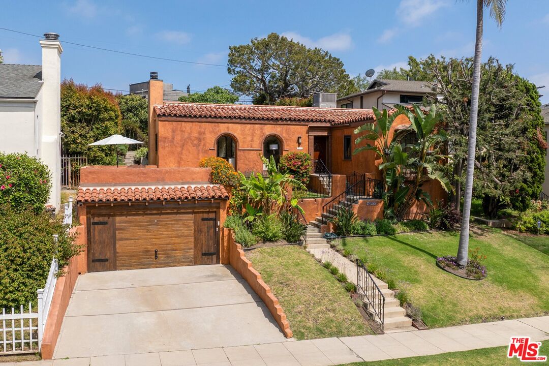 front view of a house with a garden