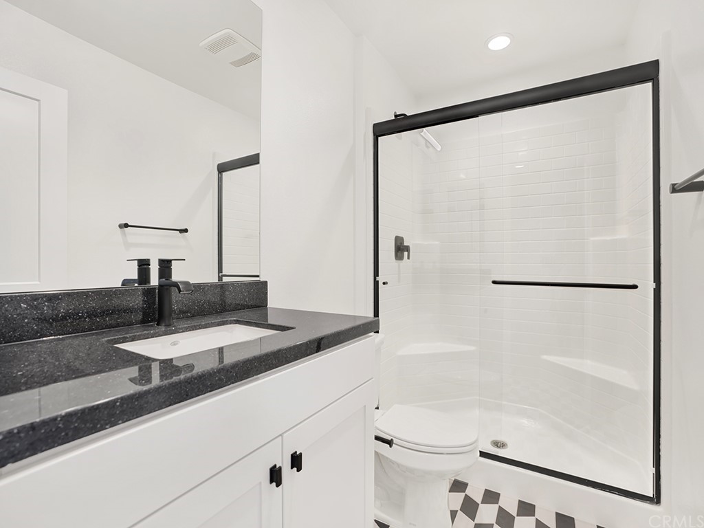 524 Caleigh Lane Costa Mesa, CA 92627 - Photo 14 of 19 a bathroom with a bathtub and a shower